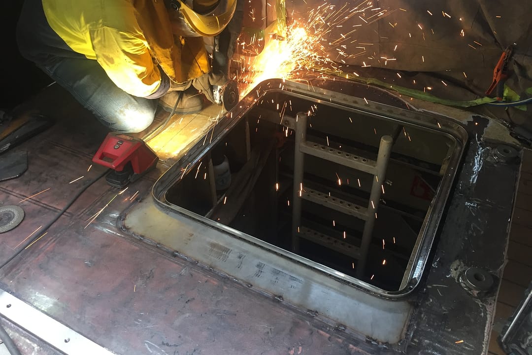 grinding steel deck hatch